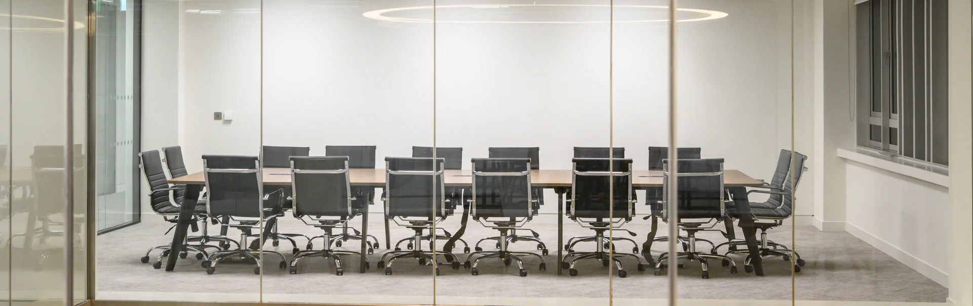 Boardroom-Chairs-with-Wooden-Long-Meeting-Room-Table-in-Boadroom-Setting