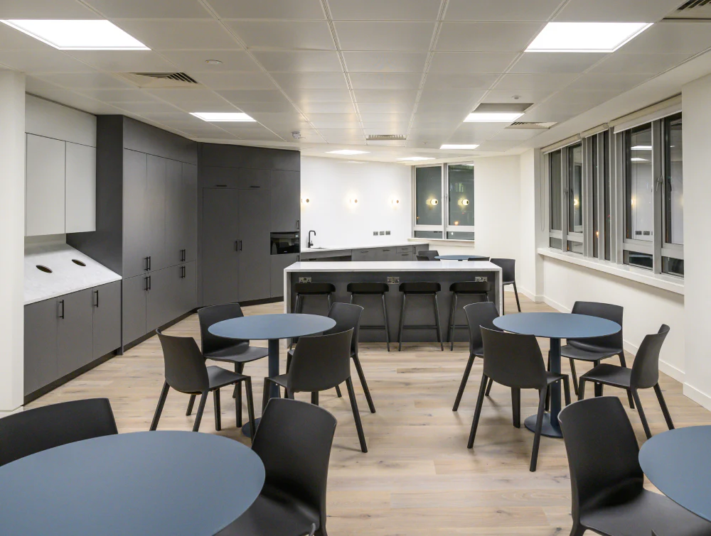 Canteen-Chairs-with-Round-Tables-and-High-Stool-in-Kitchen-Setting