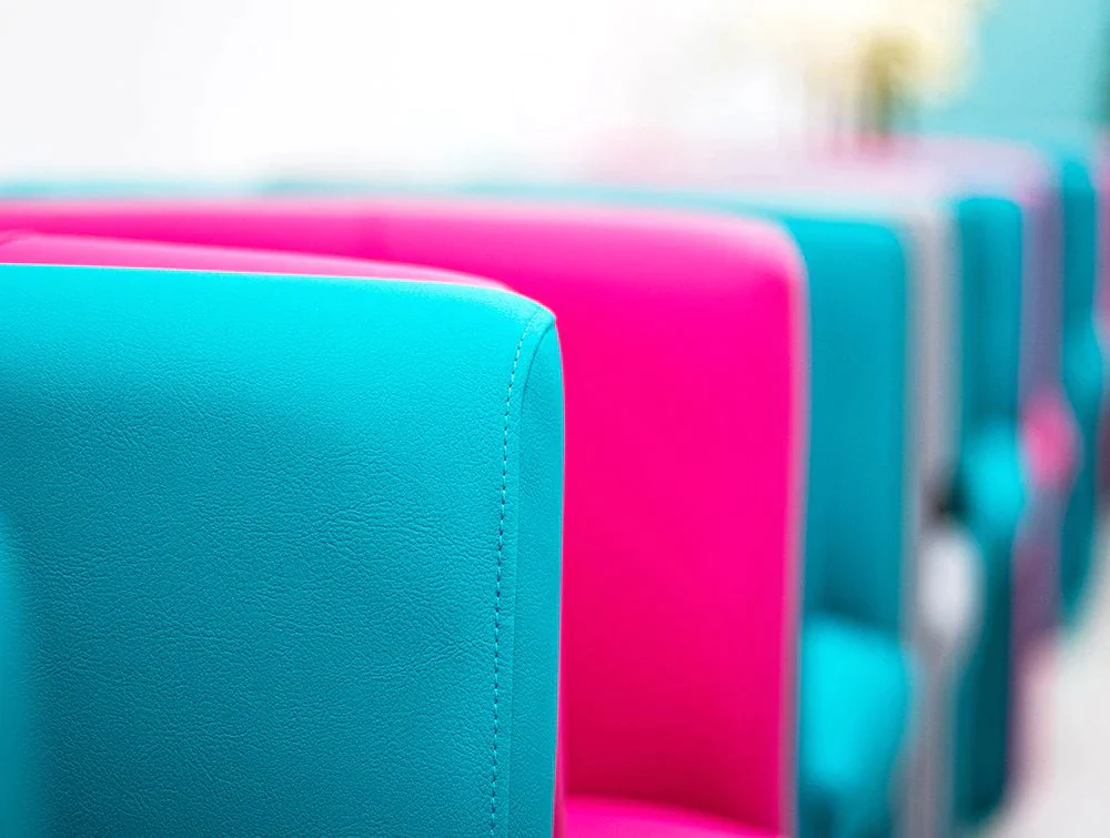 Close-up-of-bright-blue-and-magenta-chairs
