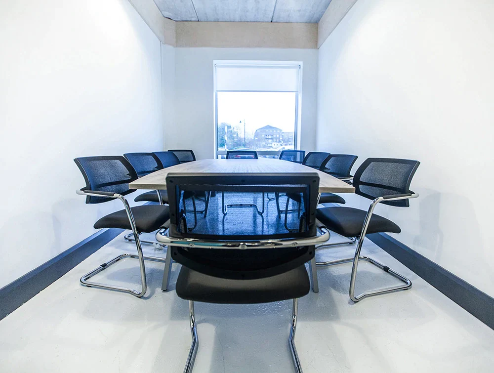 Confrence-room-with-table-and-ten-chairs