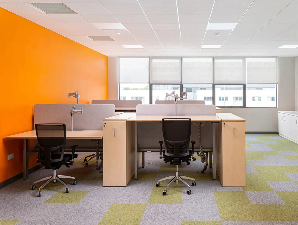 Leap-Electric-Adjustable-Desks-with-Acoustic-Desk-Dividers-Ergonomic-Monitor-Arms-and-Black-Mesh-Office-Chairs