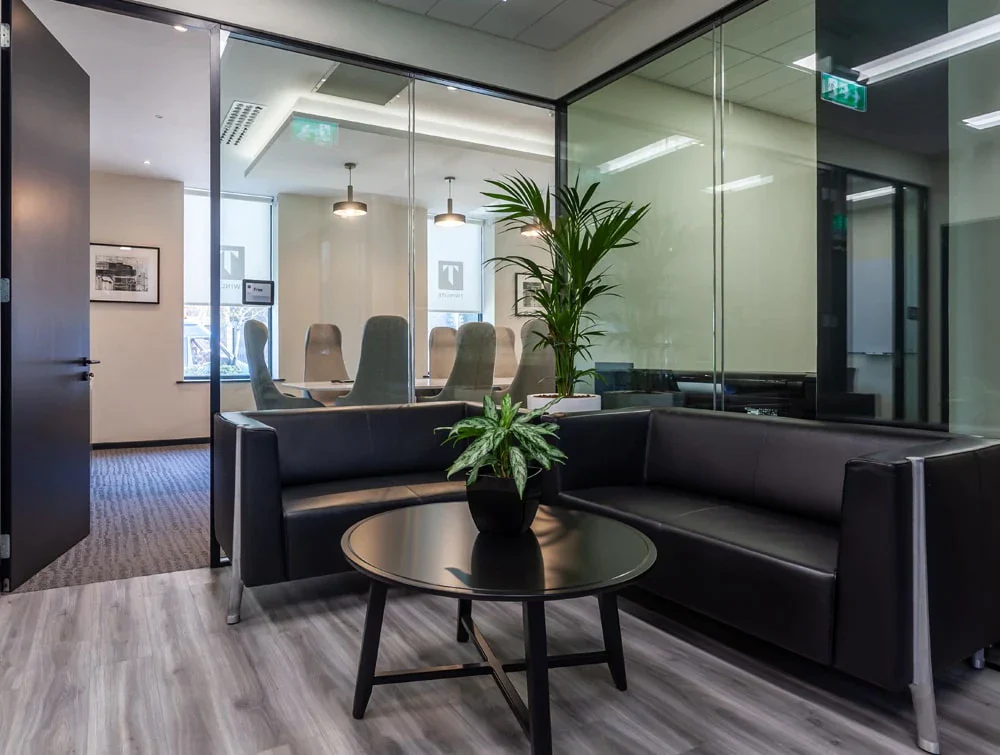 Twinlite-Office-Reception-Black-Sofa-with-Circular-Coffee-Table